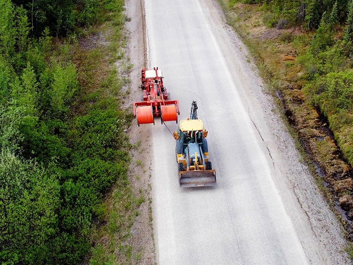 Aerial view placing buried conduit along Highway 37 North